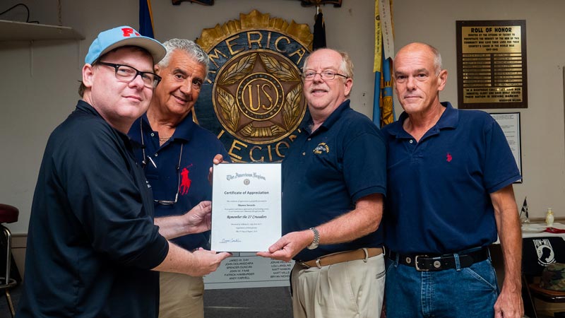 Remember the 27 Crusaders Director Sean Swords and Producer John Ricuitti accept Certificate of Appreciation from Bob Cummings and Commander Bruce Conklin